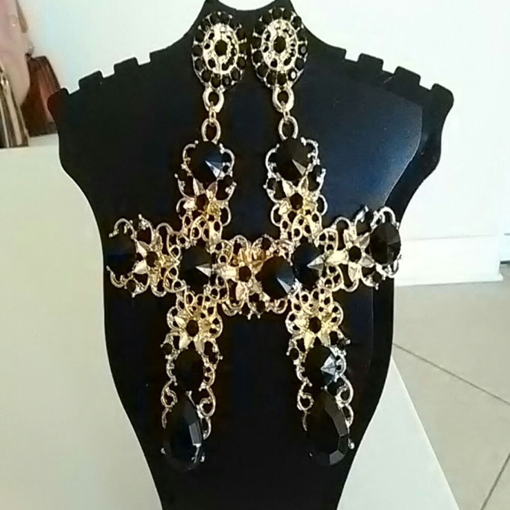 Beautiful gold and black cross earrings